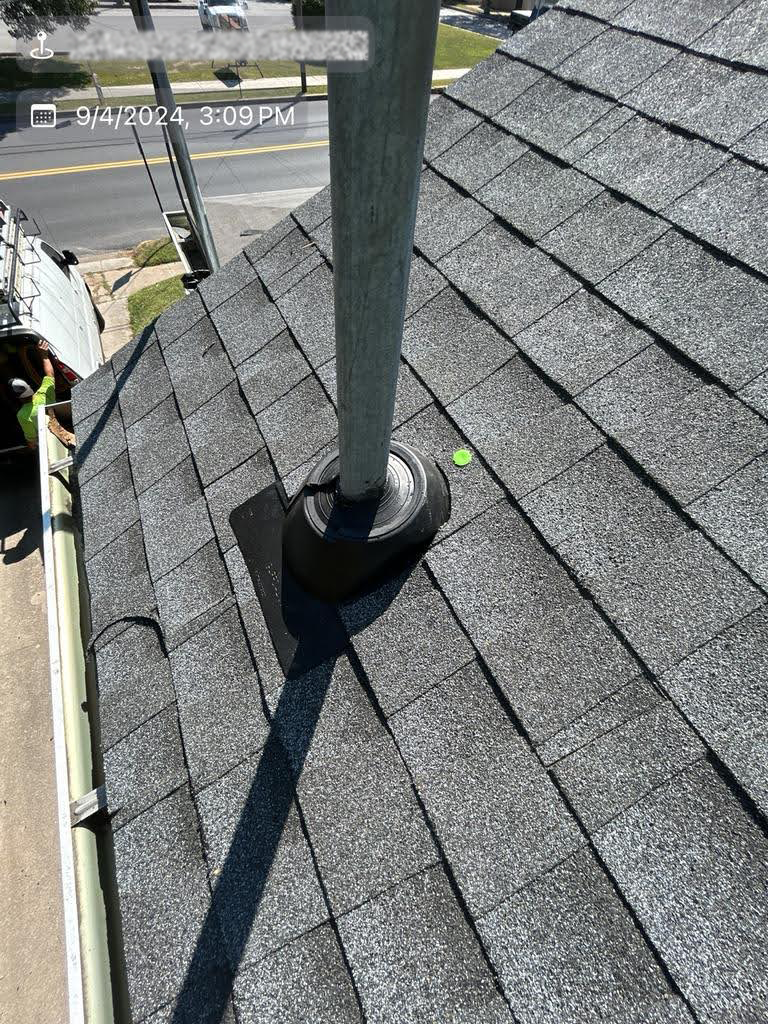 A chimney is sitting on top of a roof.