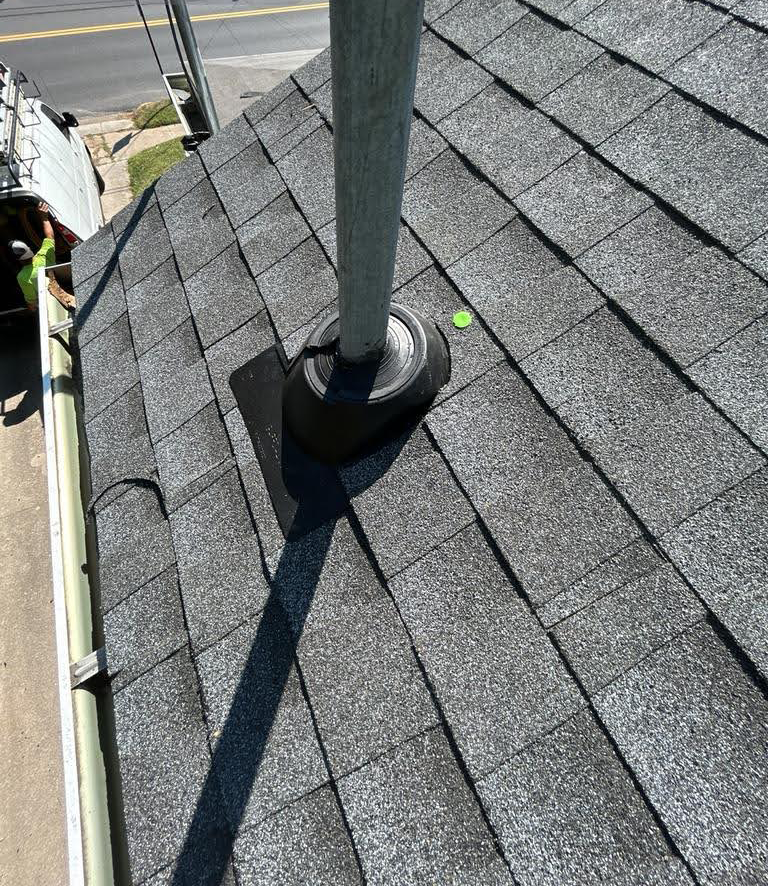 A chimney is sitting on top of a roof.