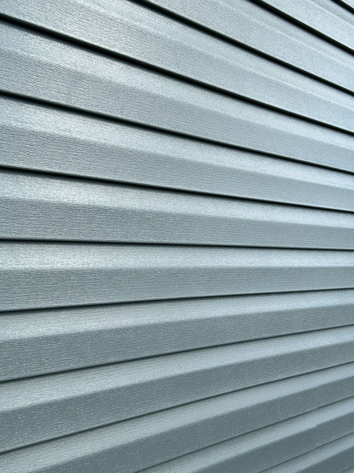 A close up of a metal siding on a building