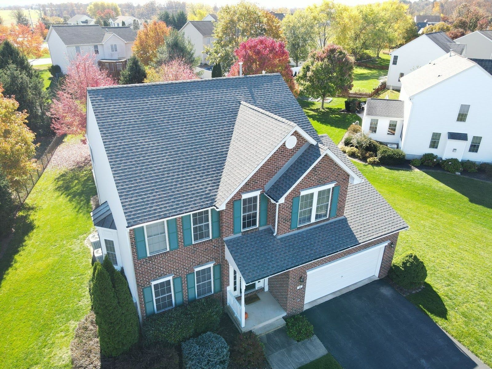 An aerial view of a house in a residential area