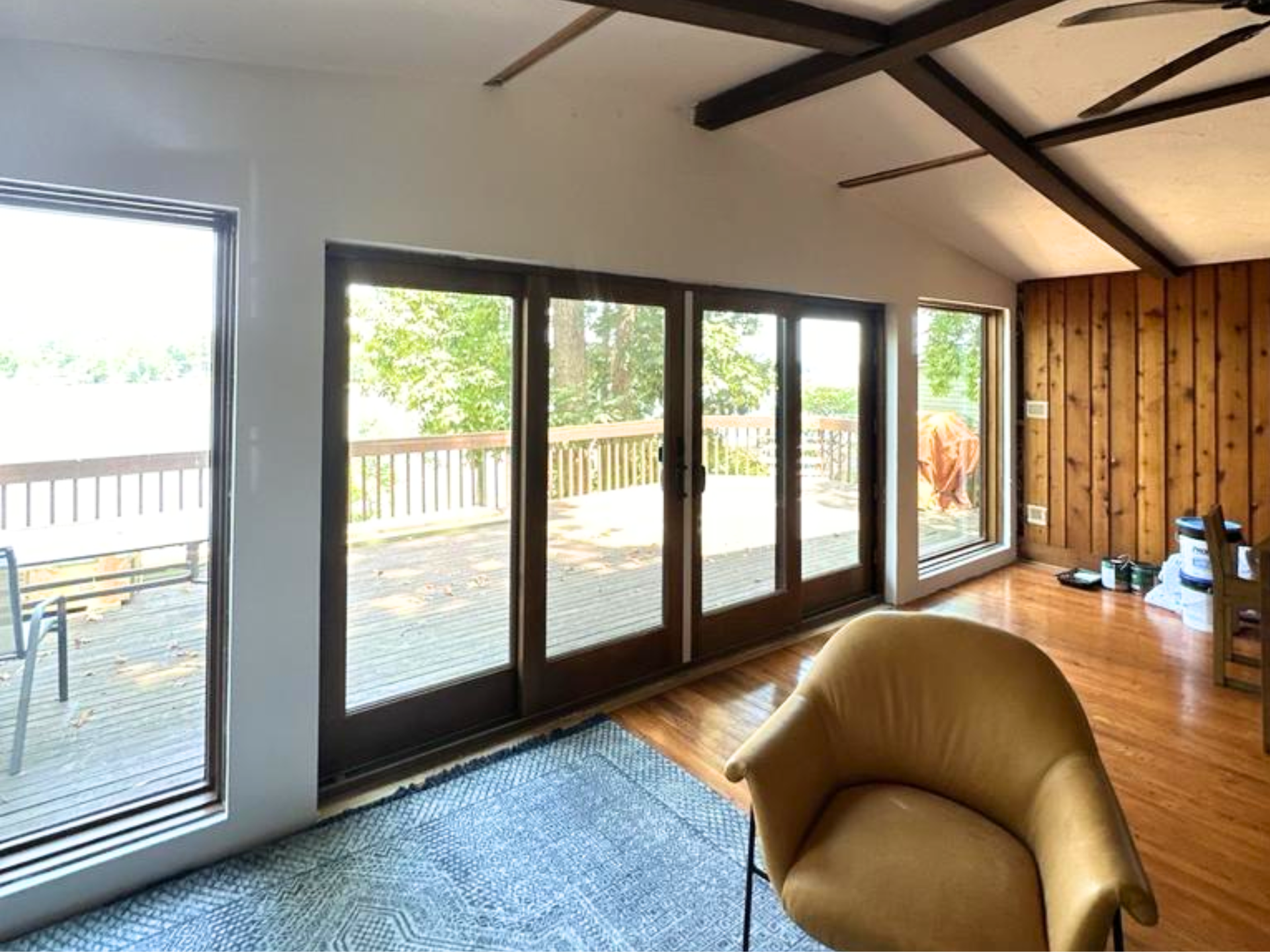 4 large windows, and a set of glass doors. 