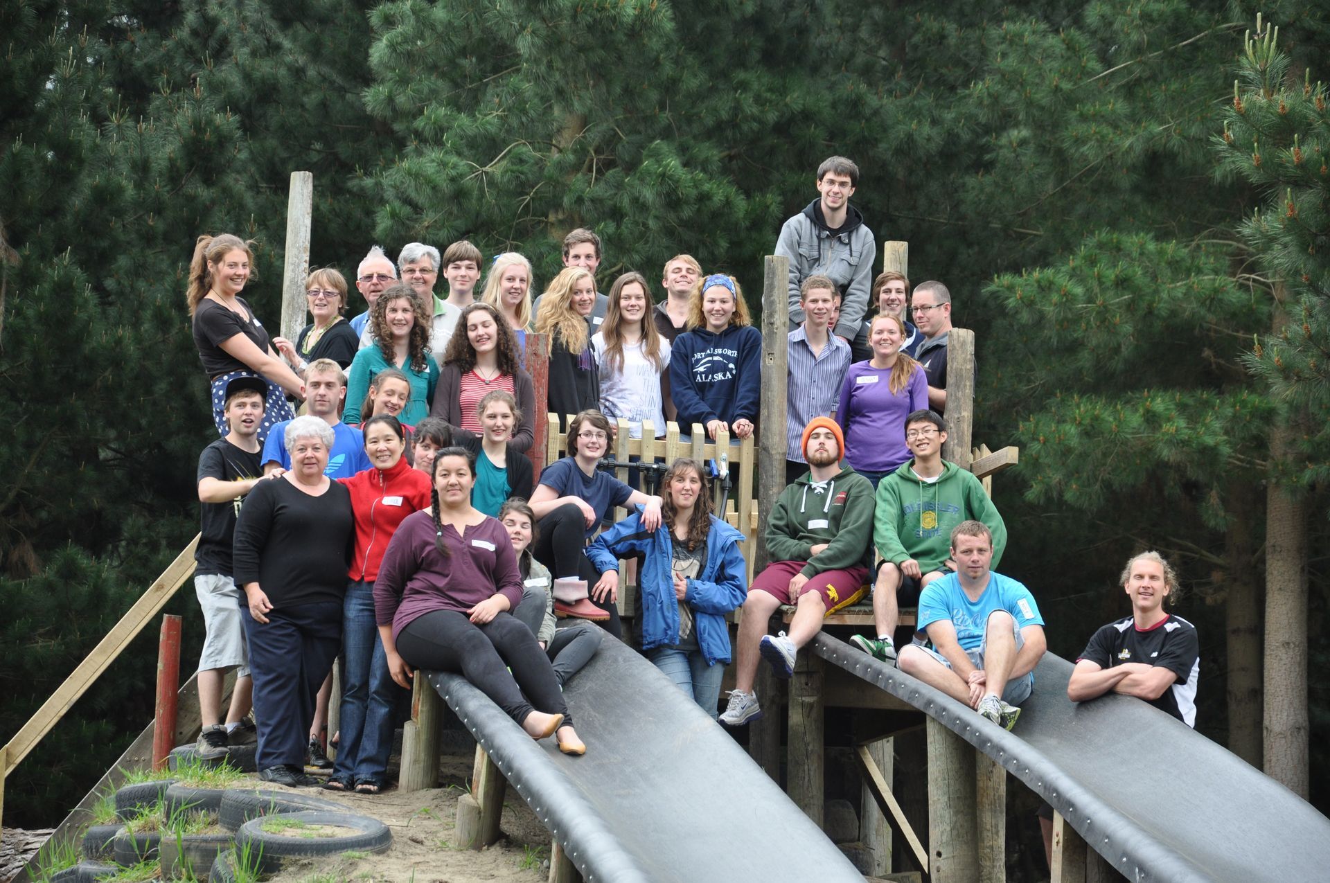 people posing for a photo on a waterslide
