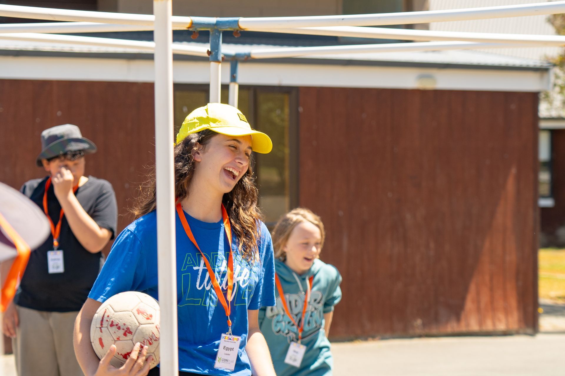 lady holding a ball at 9 square in the air