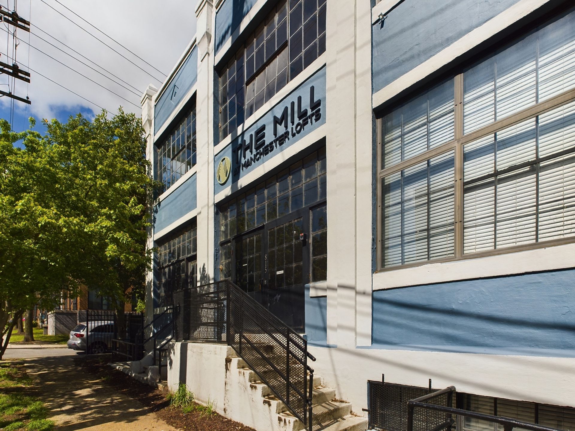 A blue and white building with the word mill on it
