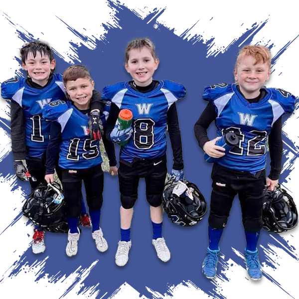 A group of young boys wearing blue jerseys with the letters w on them