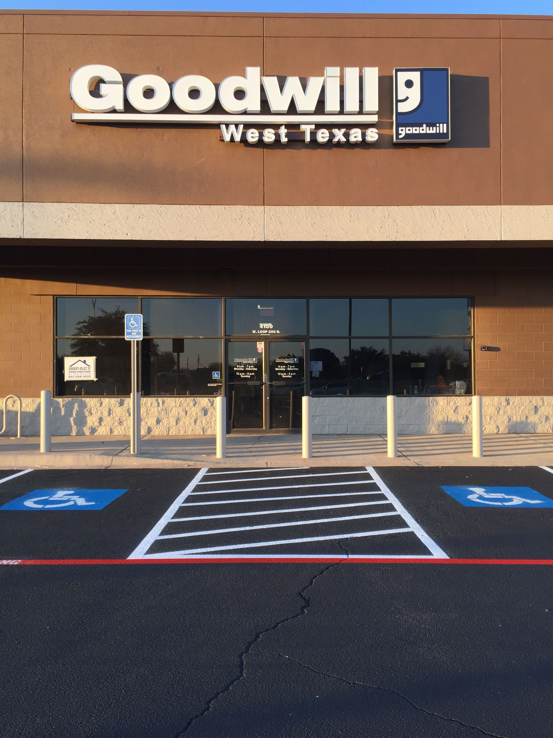 Goodwill store in West Texas, with handicap parking spaces in front.