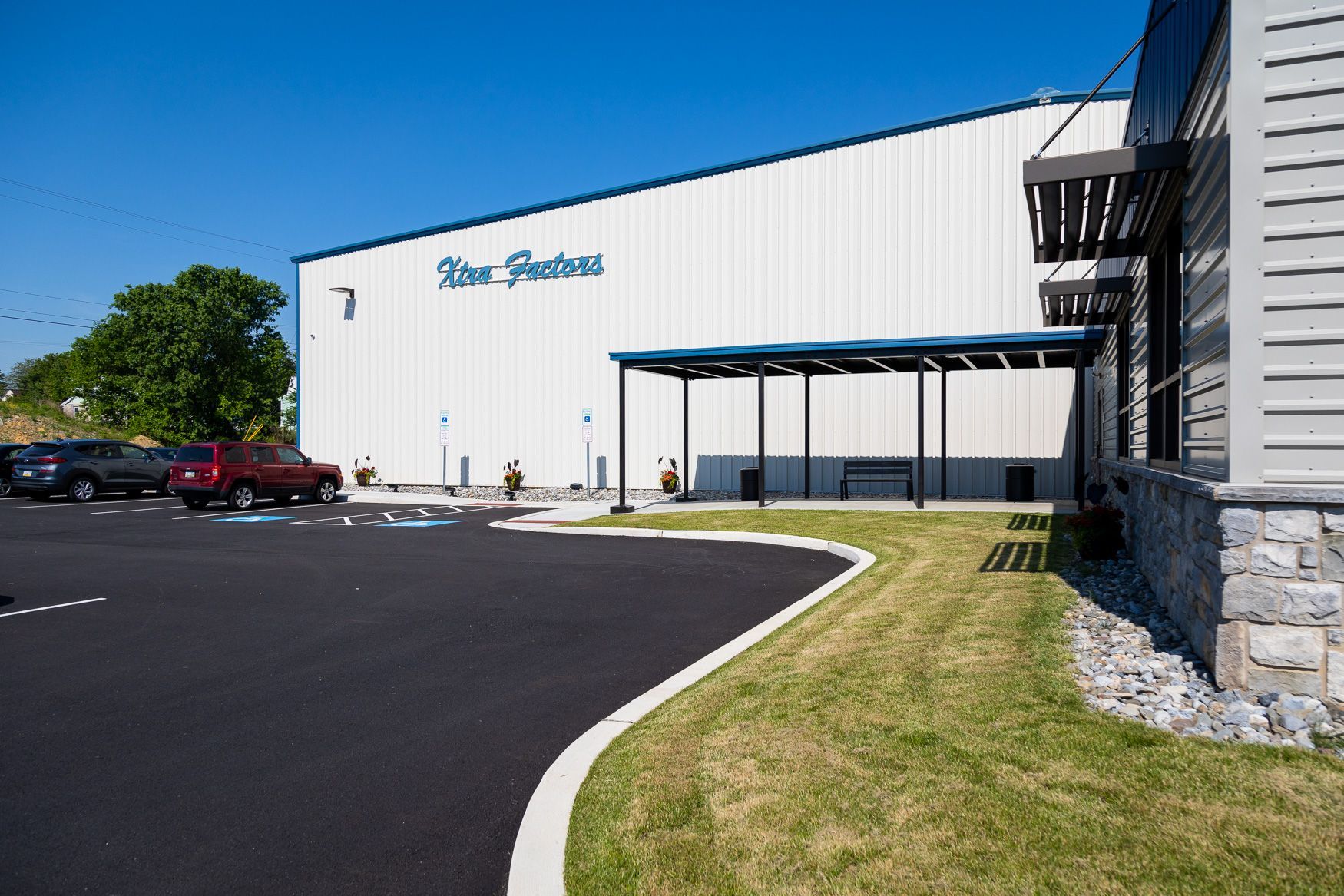 Xtra Factors East Earl, PA building with a parking lot in front of it.