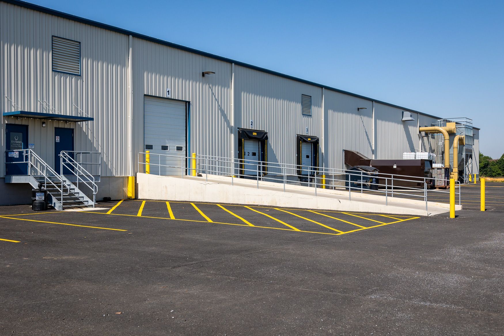 Xtra Factors East Earl, PA warehouse with a lot of forklifts and people working in it.