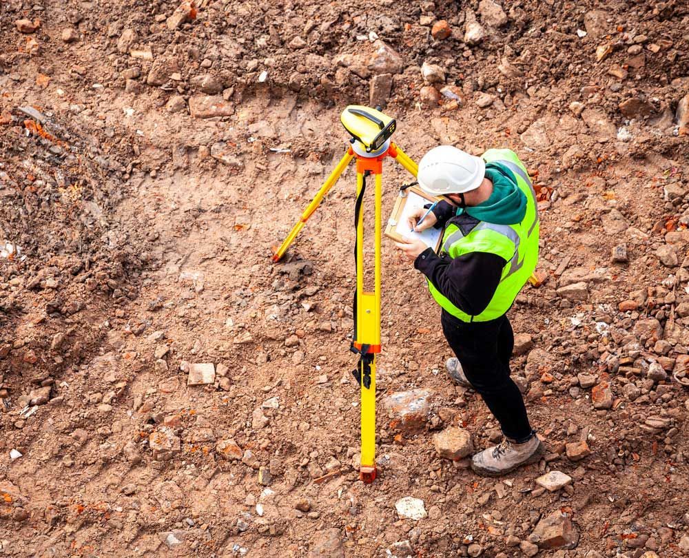 Surveyor On A Construction Site — Asheville, NC — Blue Ridge Land Surveying, Inc