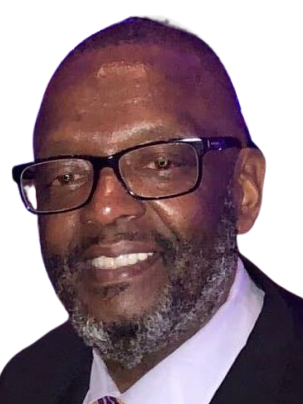 A man with glasses and a beard is smiling for the camera.