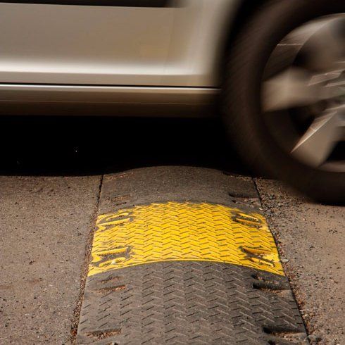 car going over speed bump