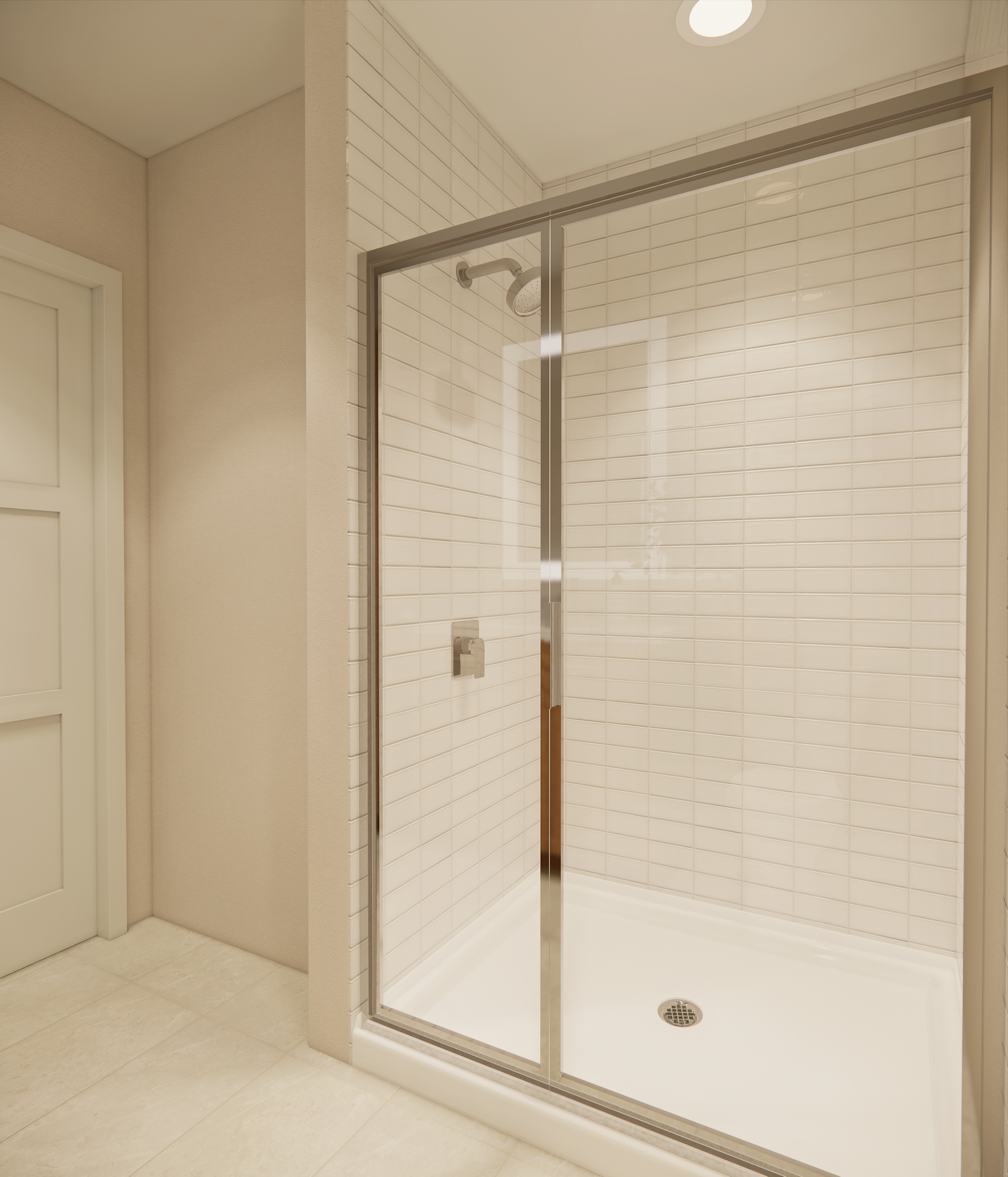 Shower with glass door, white tiled walls, and white floor in a bathroom.