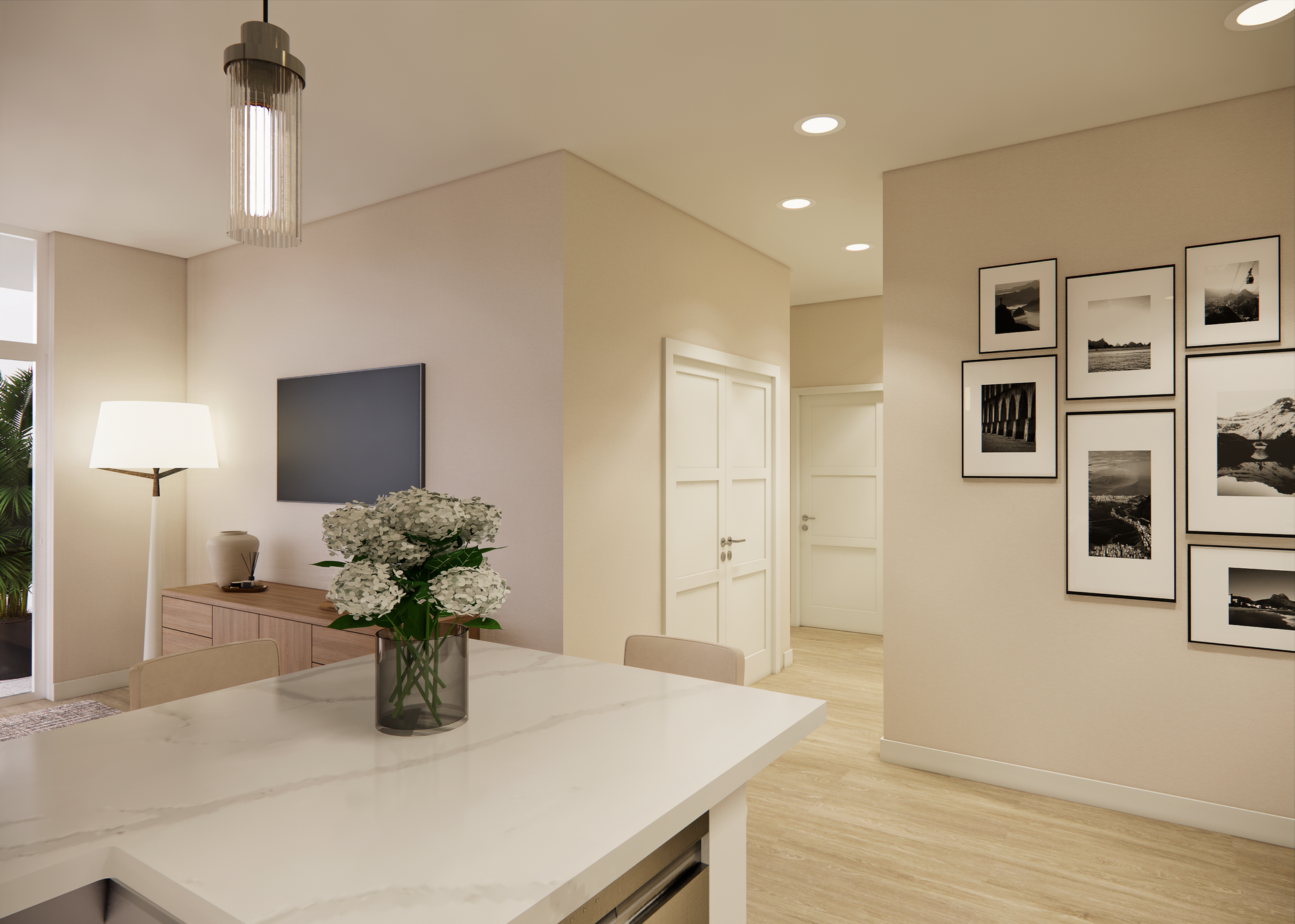 Modern interior with kitchen island, wall art, and TV. Neutral colors, natural light.