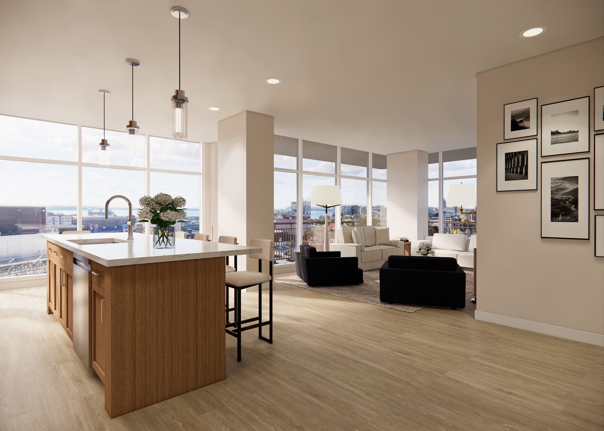 Modern open-concept apartment with a kitchen island, floor-to-ceiling windows, and a living area with city views.