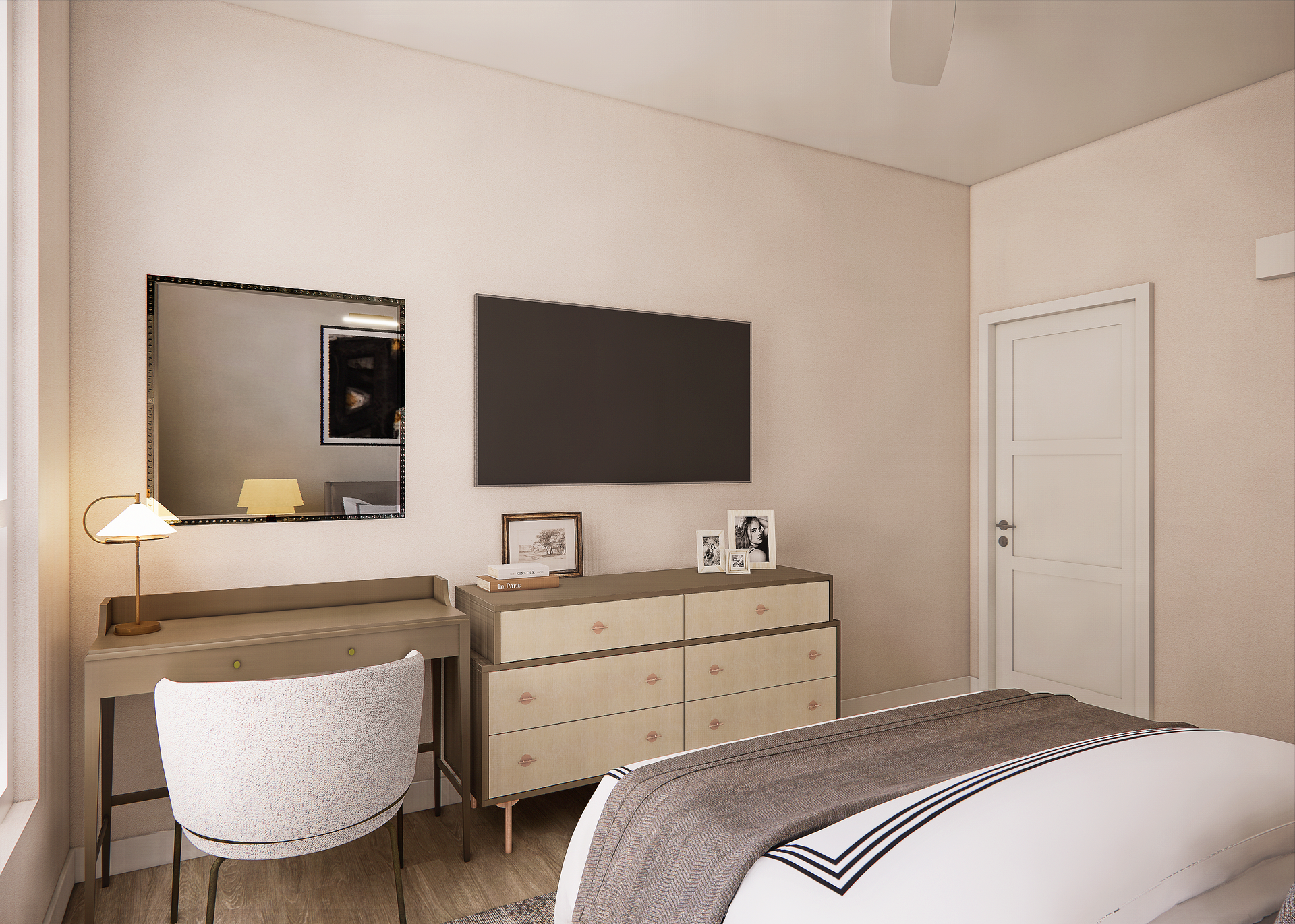 Bedroom with desk, mirror, TV, dresser, bed, and white door.