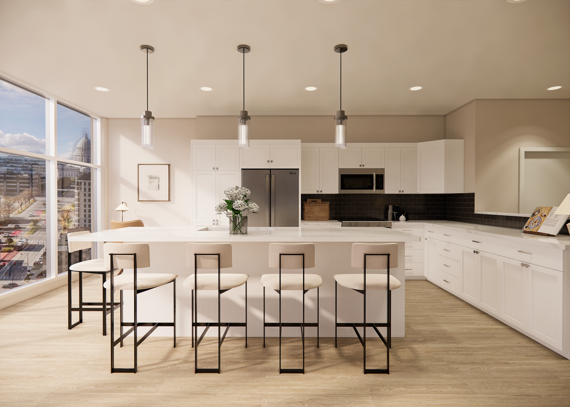 Modern white kitchen with island, bar stools, and city views through large windows.