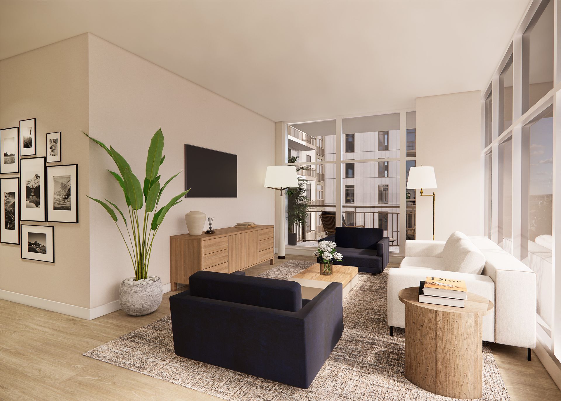 A modern, sunlit apartment living area with framed wall art, an open kitchen, and floor-to-ceiling windows overlooking a city.