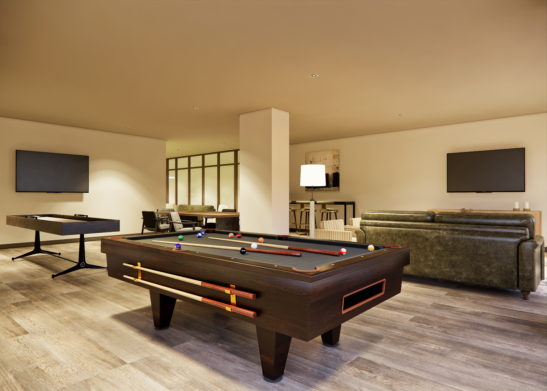 Pool table in a game room with other games, seating, and TVs on light-colored walls.