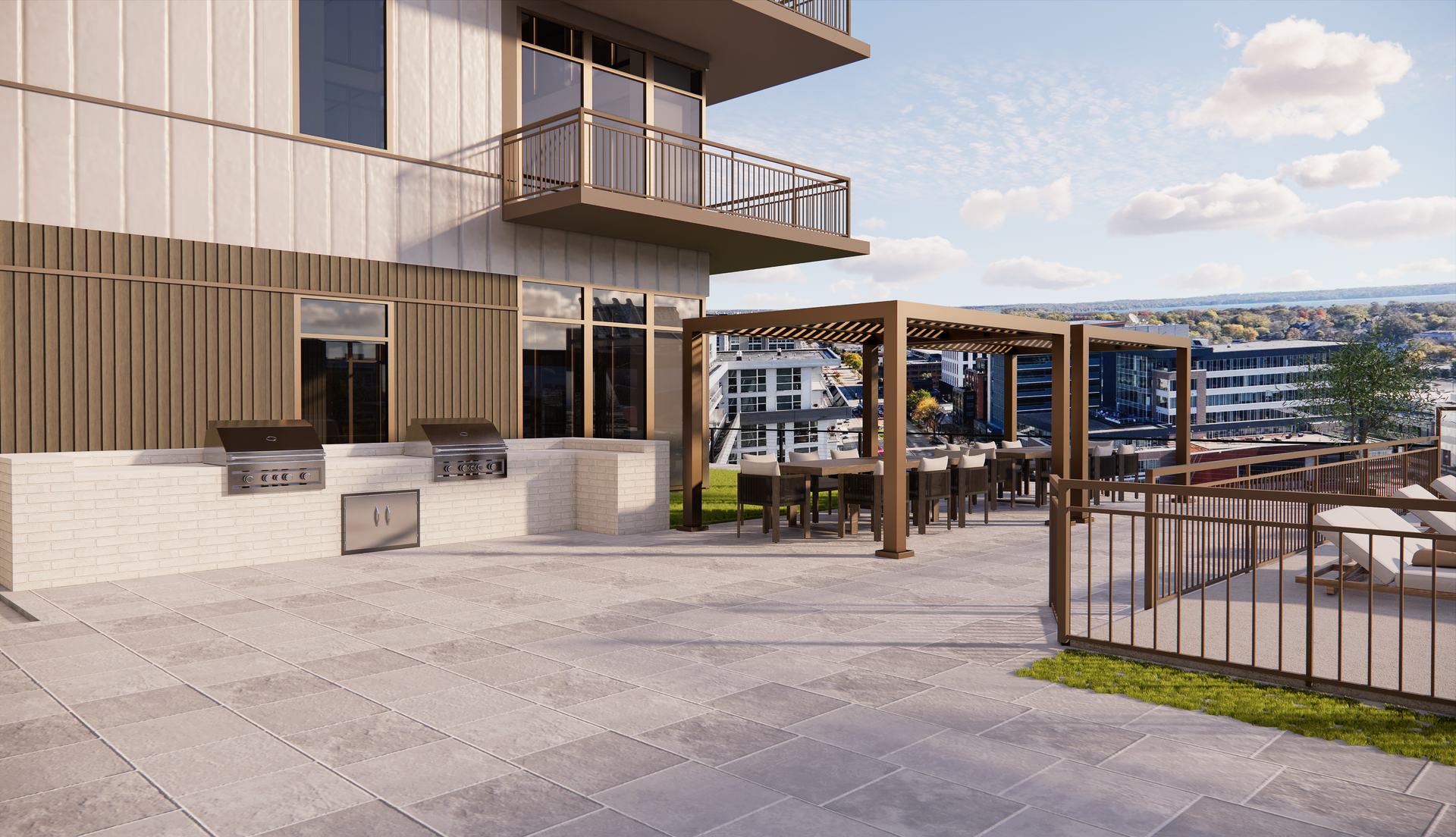 Outdoor patio with grills, seating, and city views.