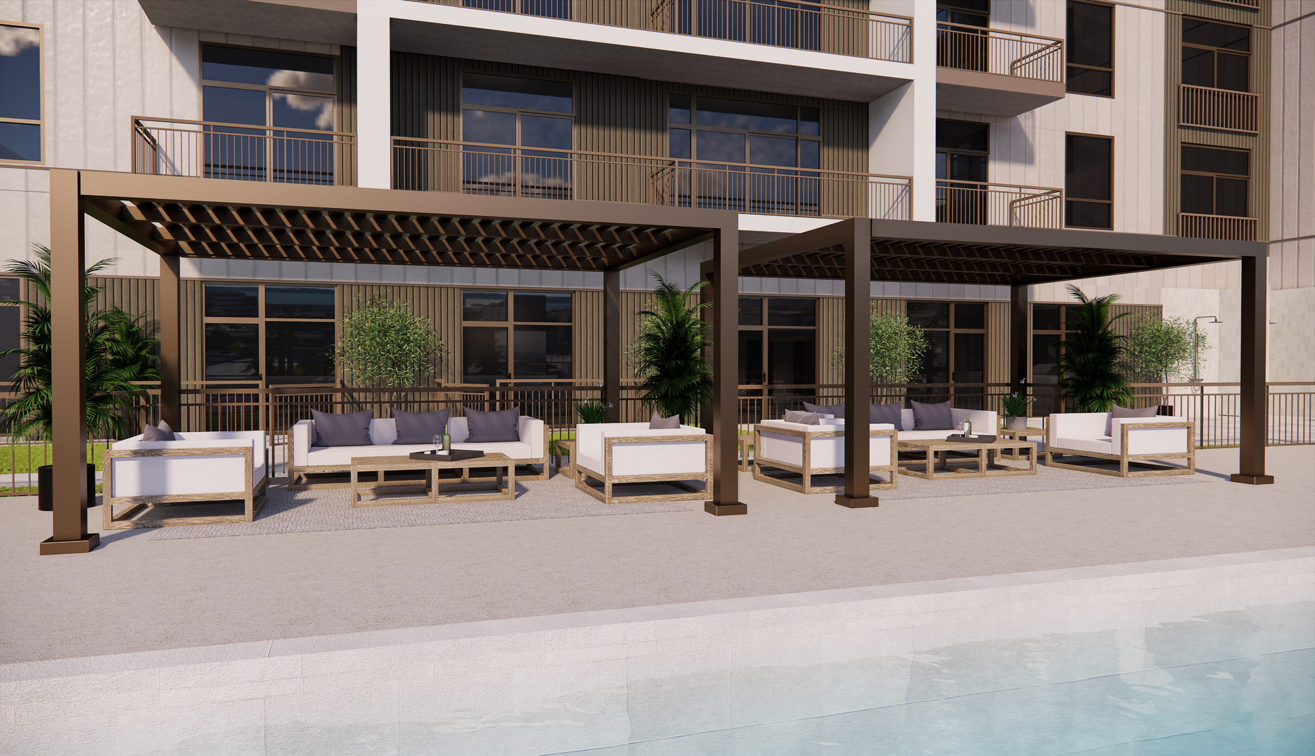 Outdoor lounge area with pergolas, couches, and a pool in front of a modern building.