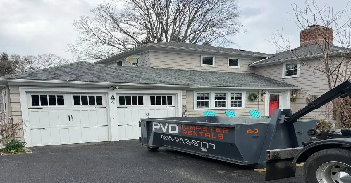 PVD Dumpster Rental 10-yard container delivered to residential driveway in Rhode Island