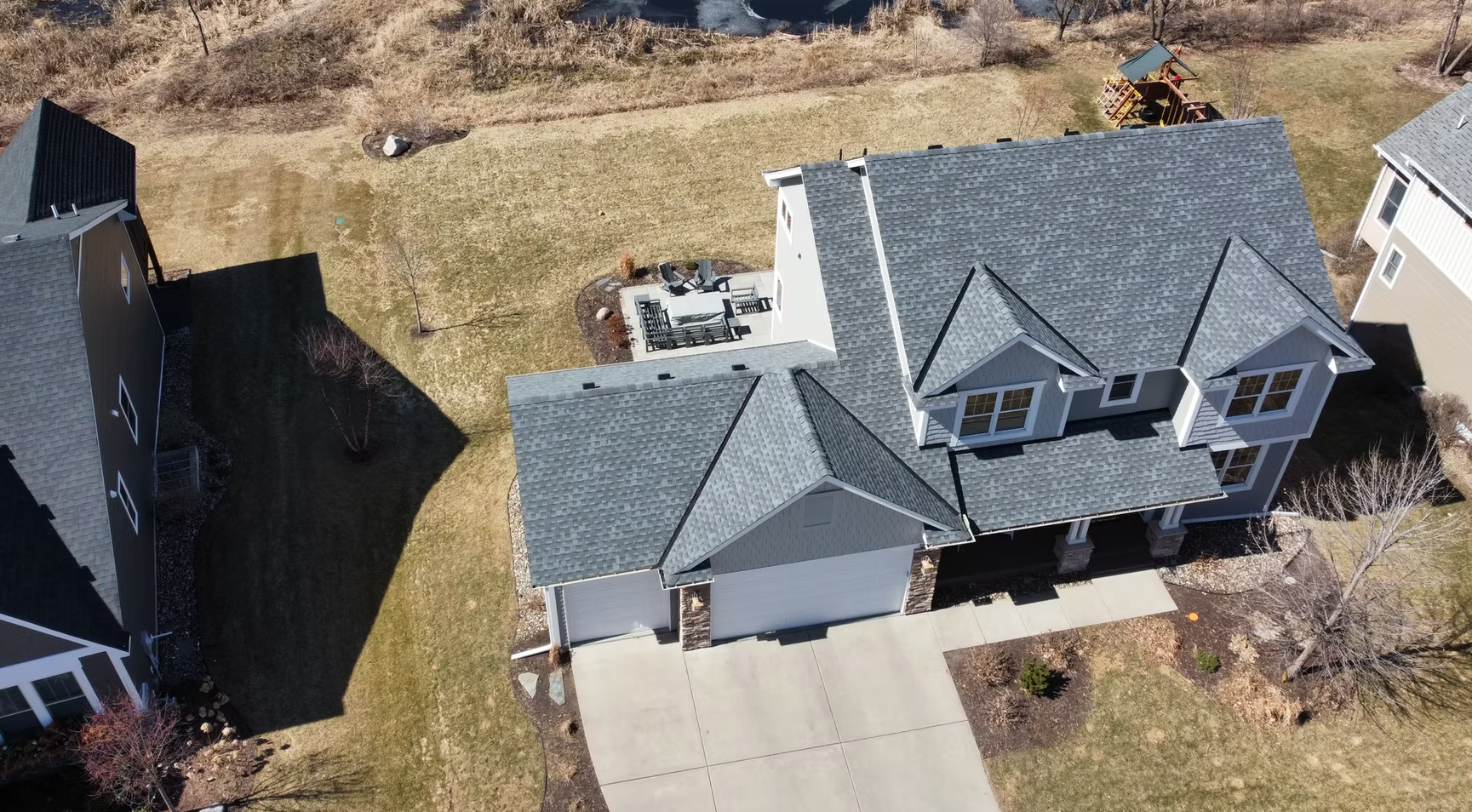 Gray metal roof with ridge cap and corrugated panels; exterior view.