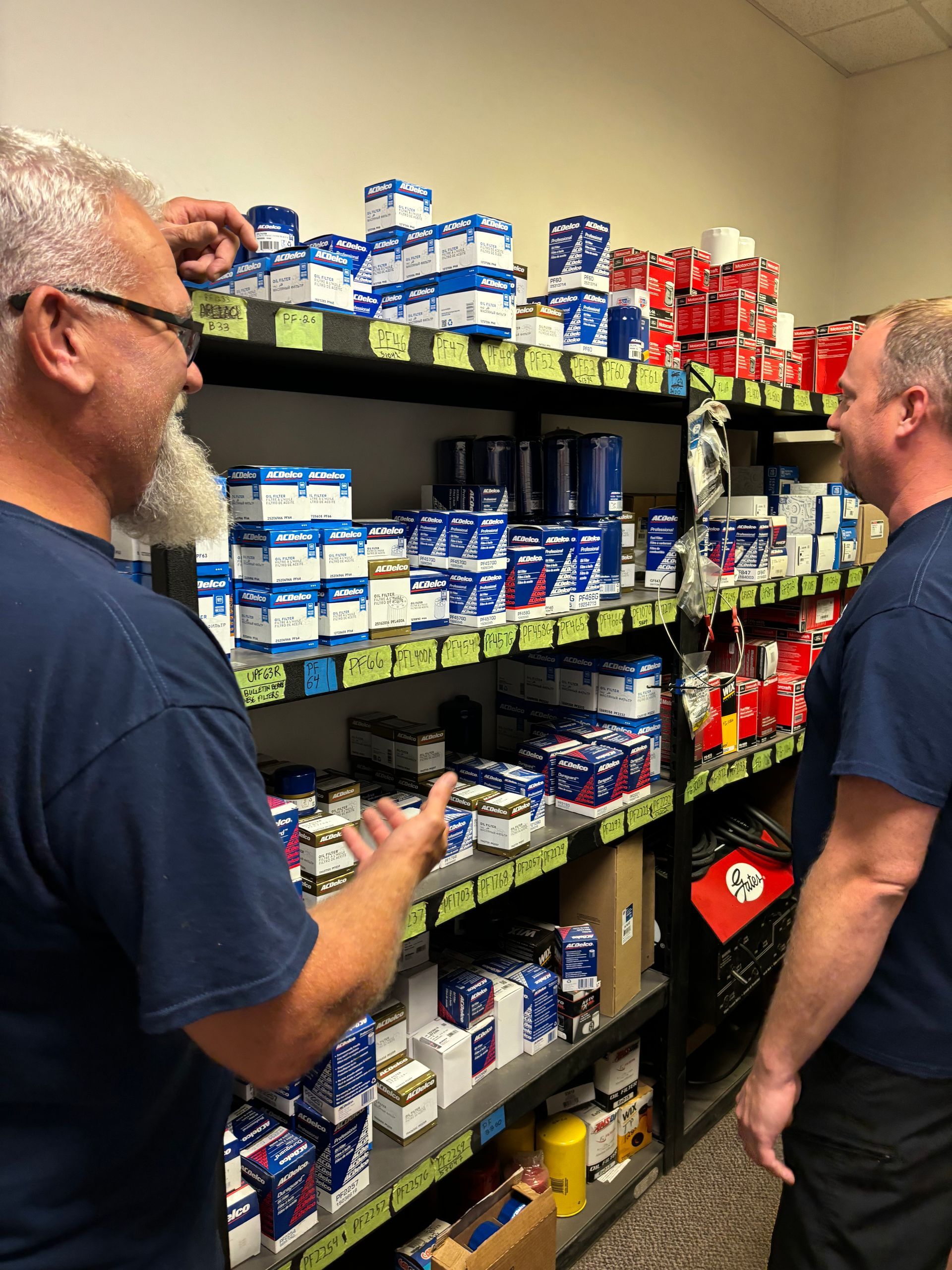 Mechanics browsing shelves of automotive supplies | Stephen's Automotive