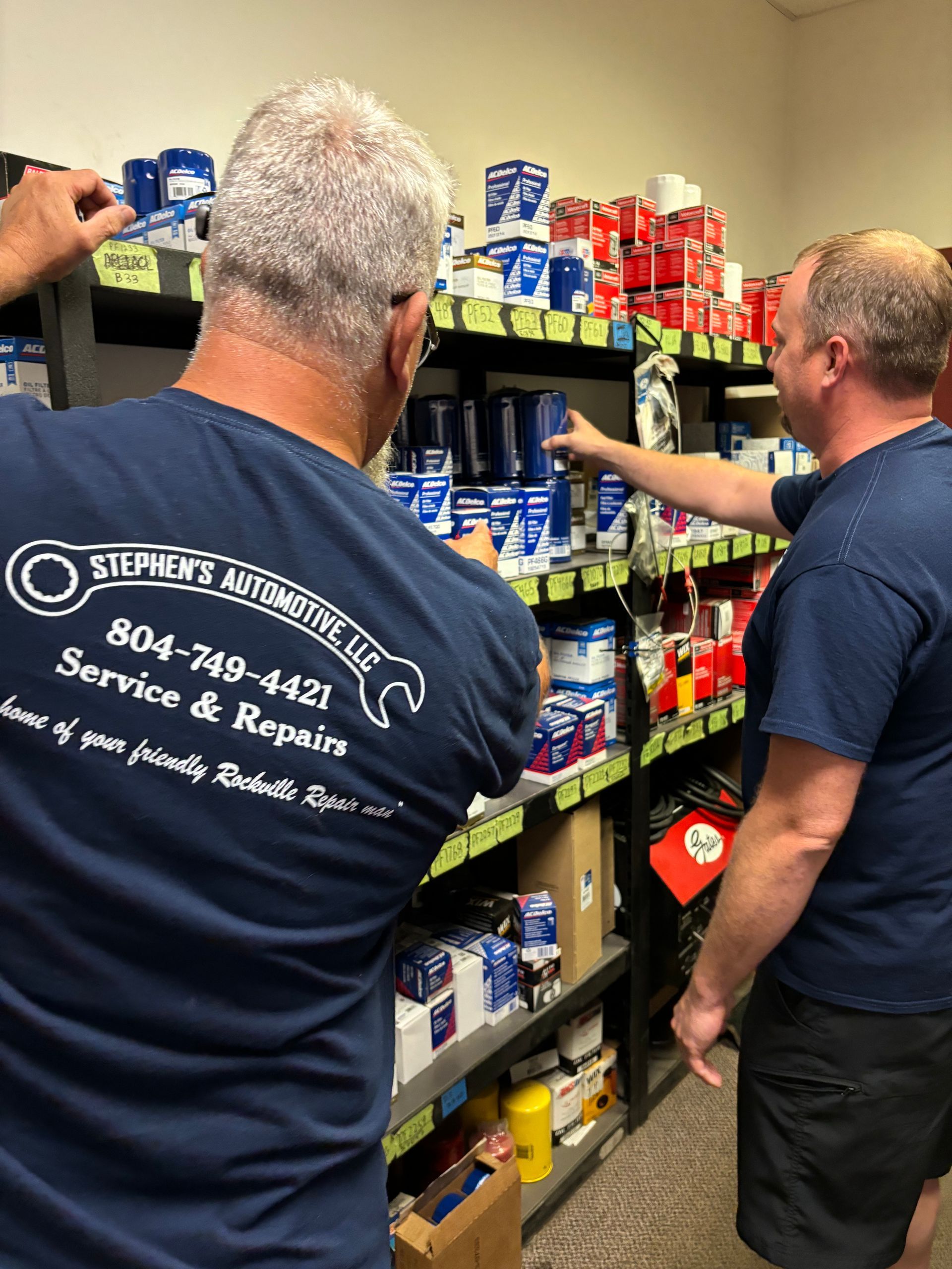 Mechanics browsing shelves of automotive supplies | Stephen's Automotive