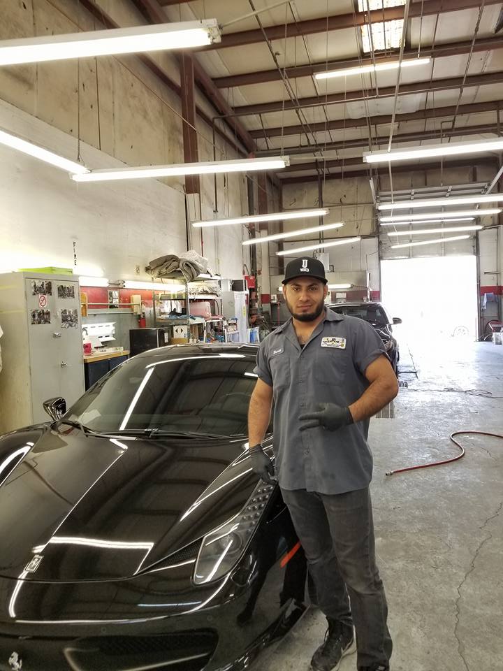 Man Beside Black Car — Las Vegas, NV — Exoticar Paintworks Inc.