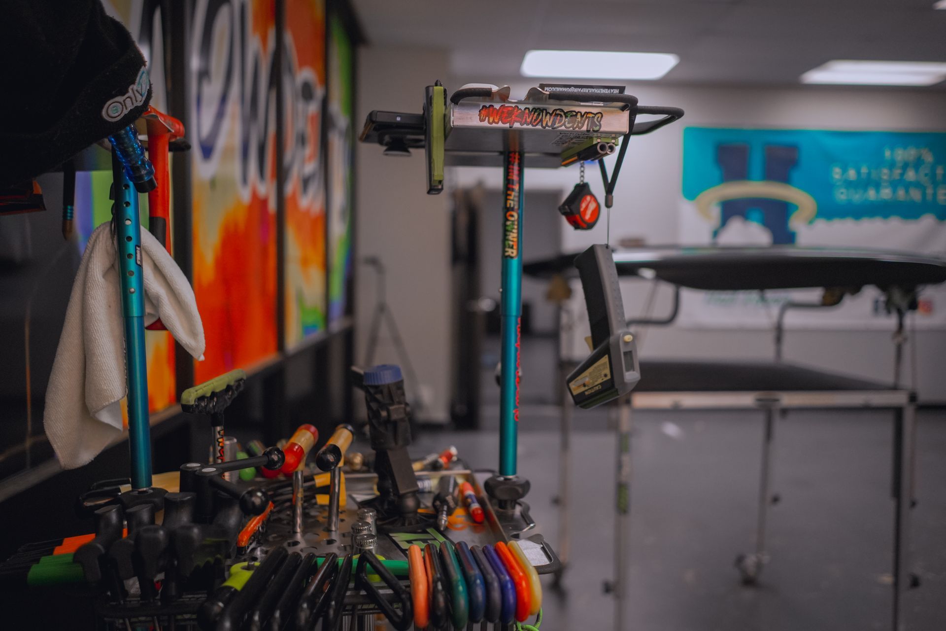 a bunch of tools are sitting on a table in a room.