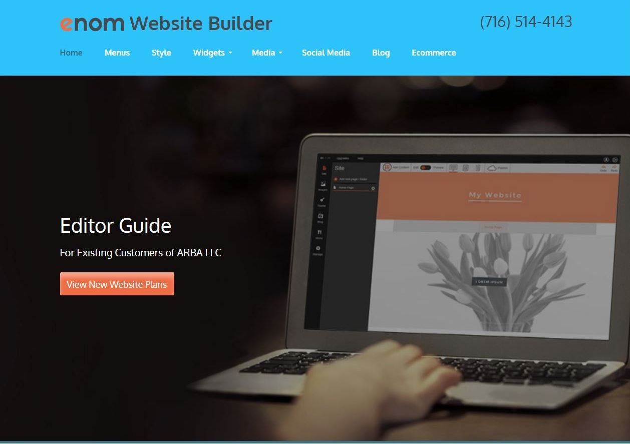 A person is typing on a laptop computer.