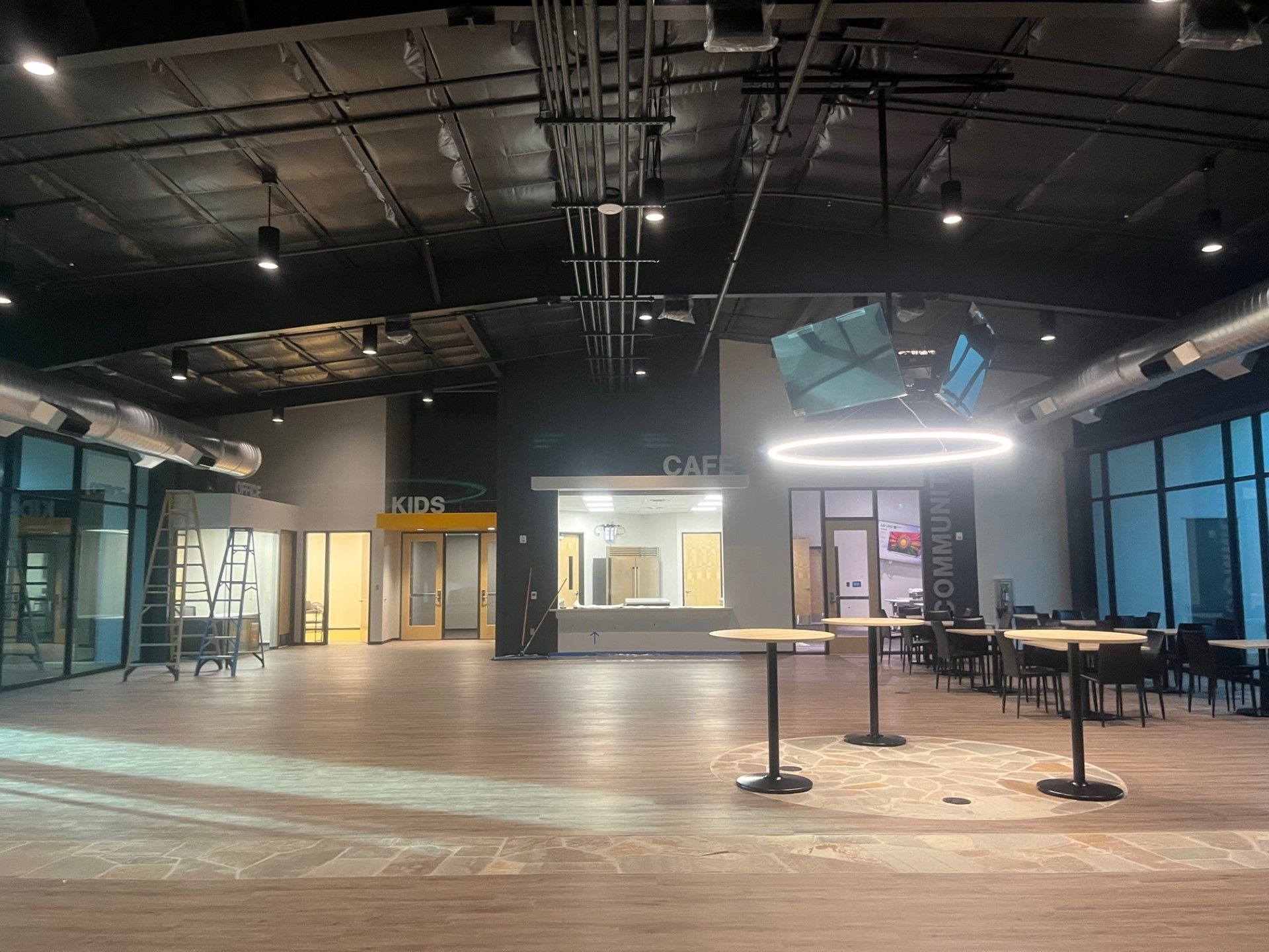 Large Area with Round Tables and Cafe and Kids Sign | Flagstaff, AZ | Colter Electric