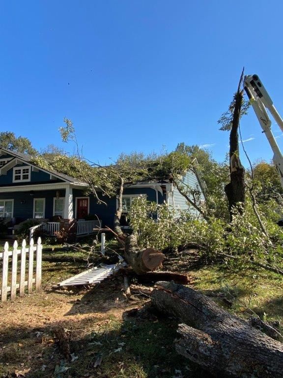 Arkansas Restoration Services Inc Russellville AR tree damage crane house