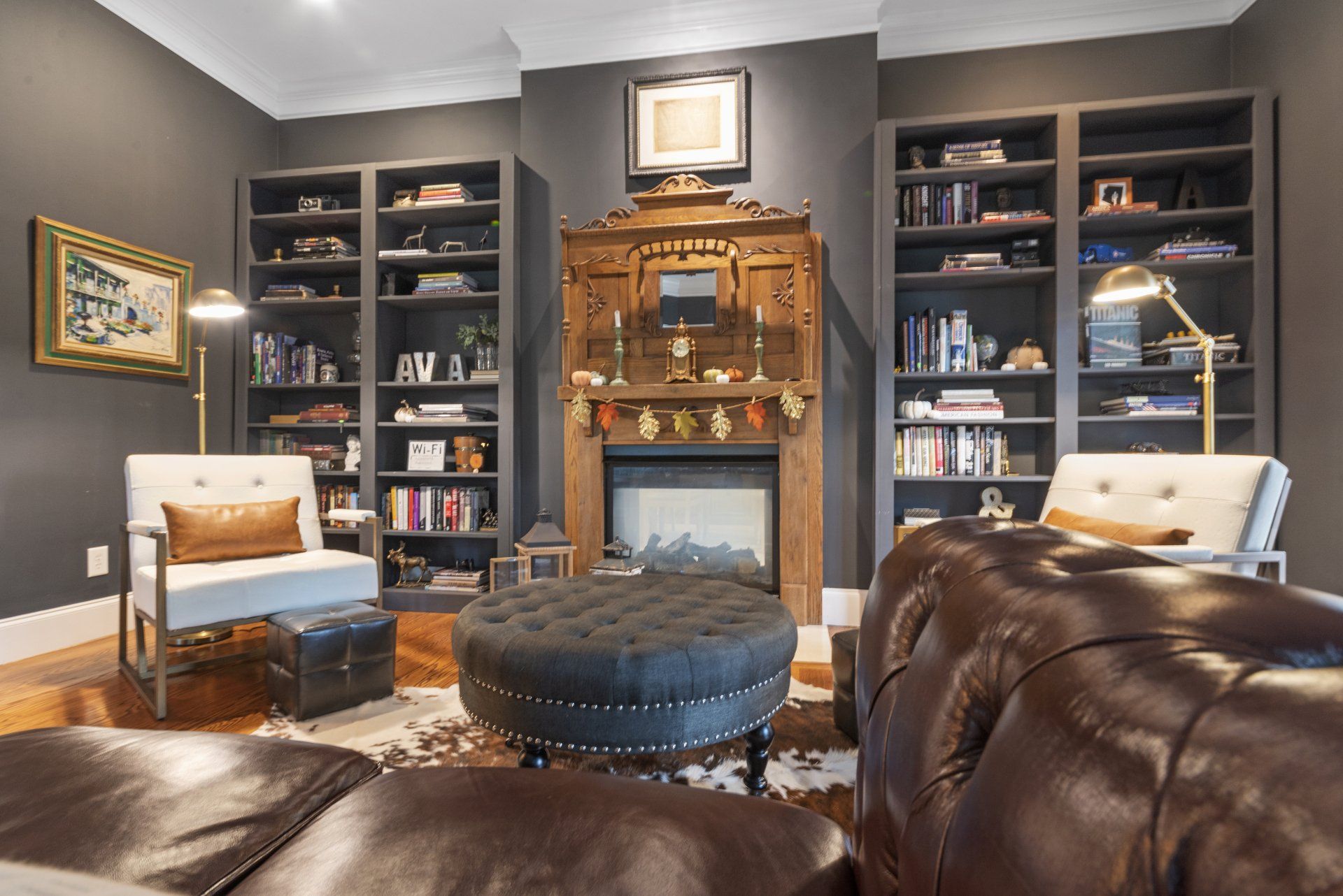 A living room filled with furniture and a fireplace.