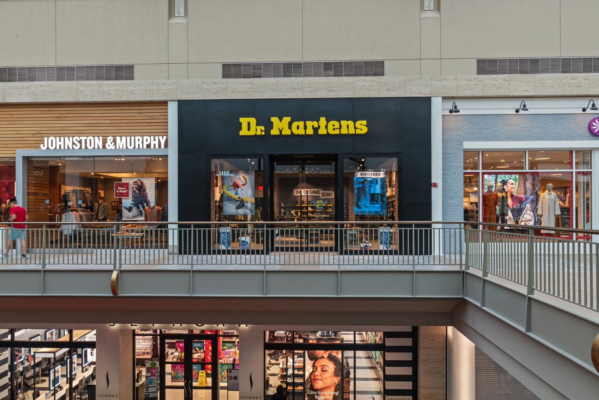 A dr. martens store is located in a shopping mall.