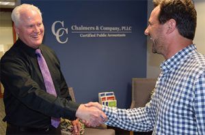 Mike Chalmers Shaking Hands with Man — Bloomington, MN — Chalmers and Company, PLLC
