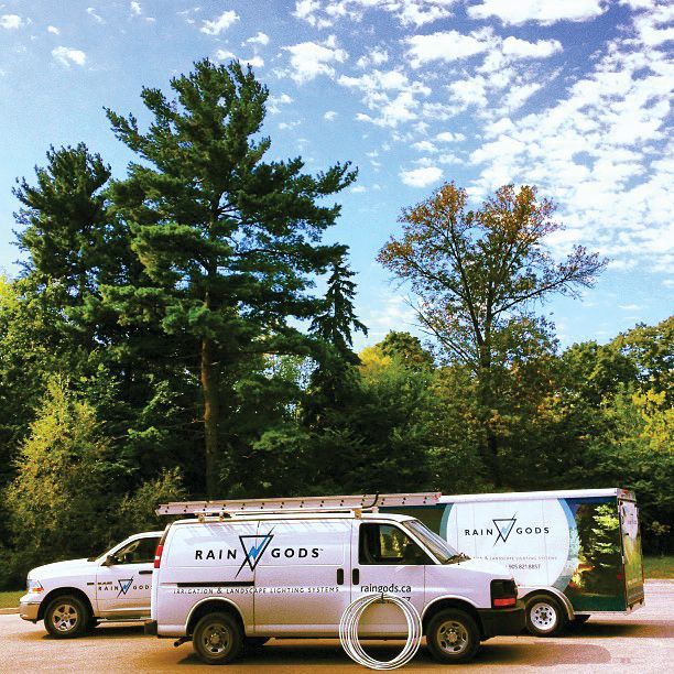 Two rain gods vans are parked next to each other