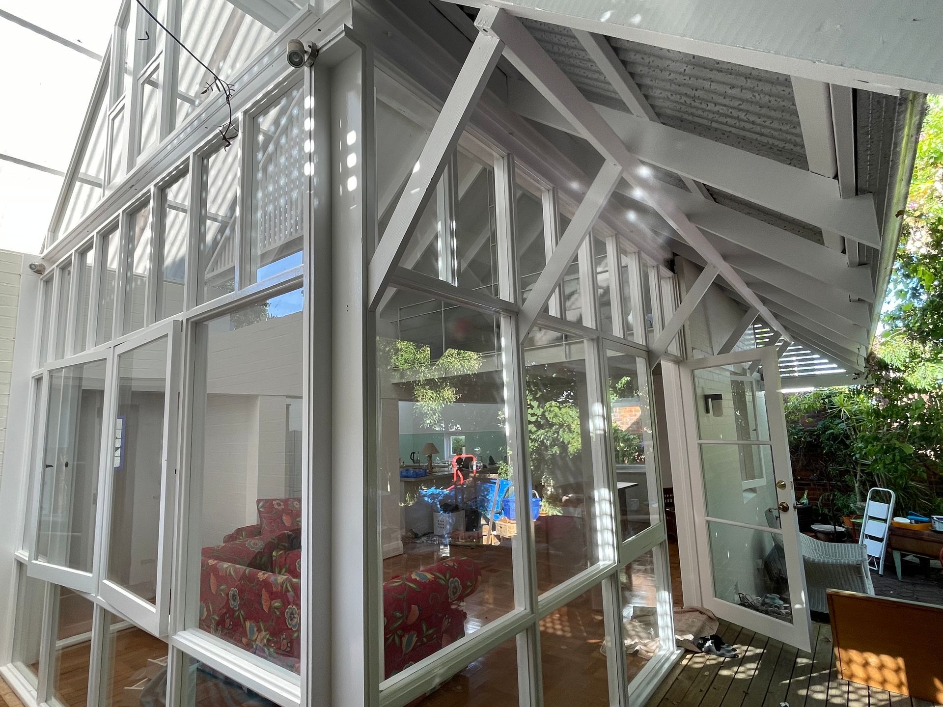 A house with a lot of windows and a roof.