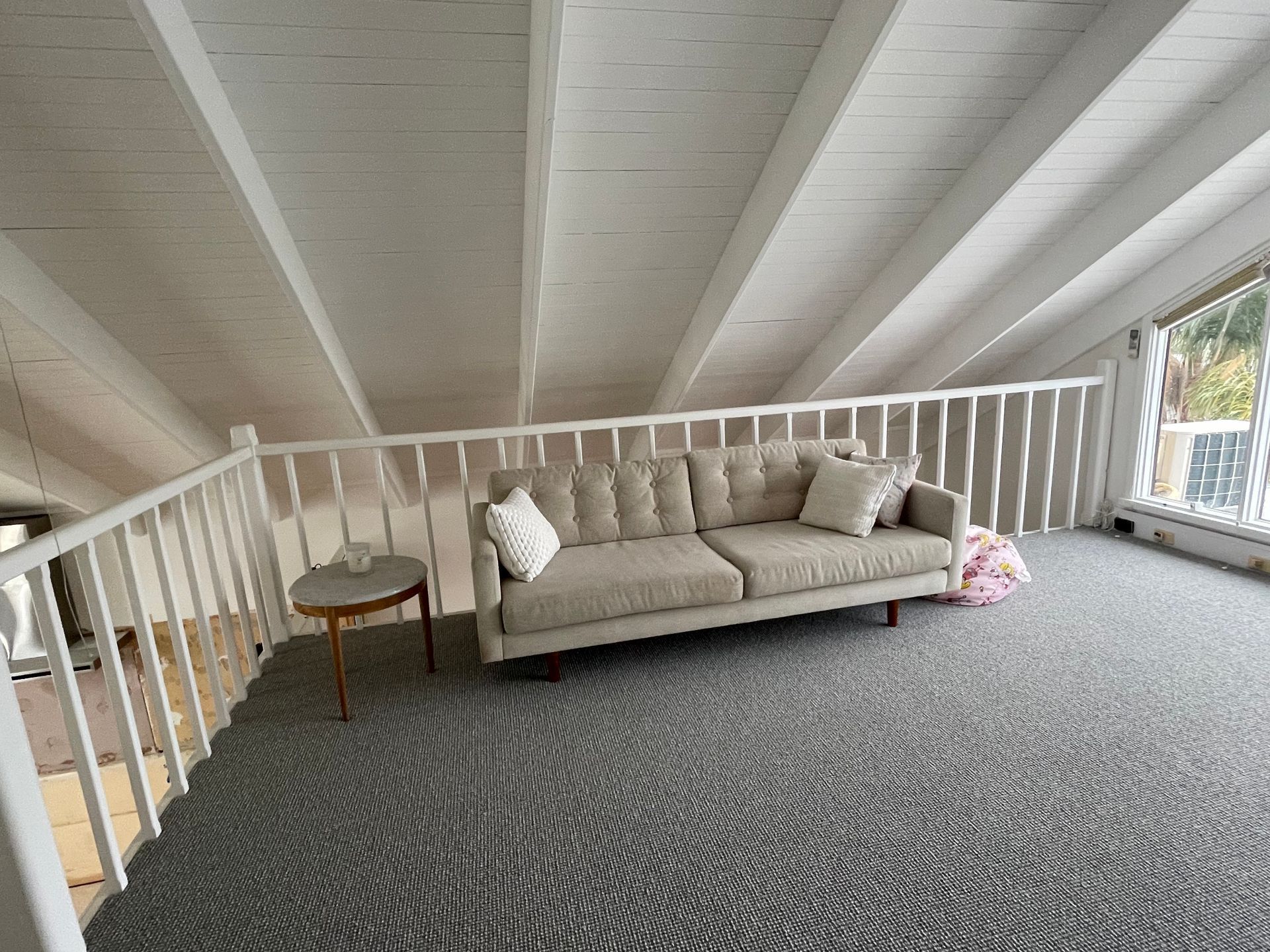 There is a couch in the middle of the room.