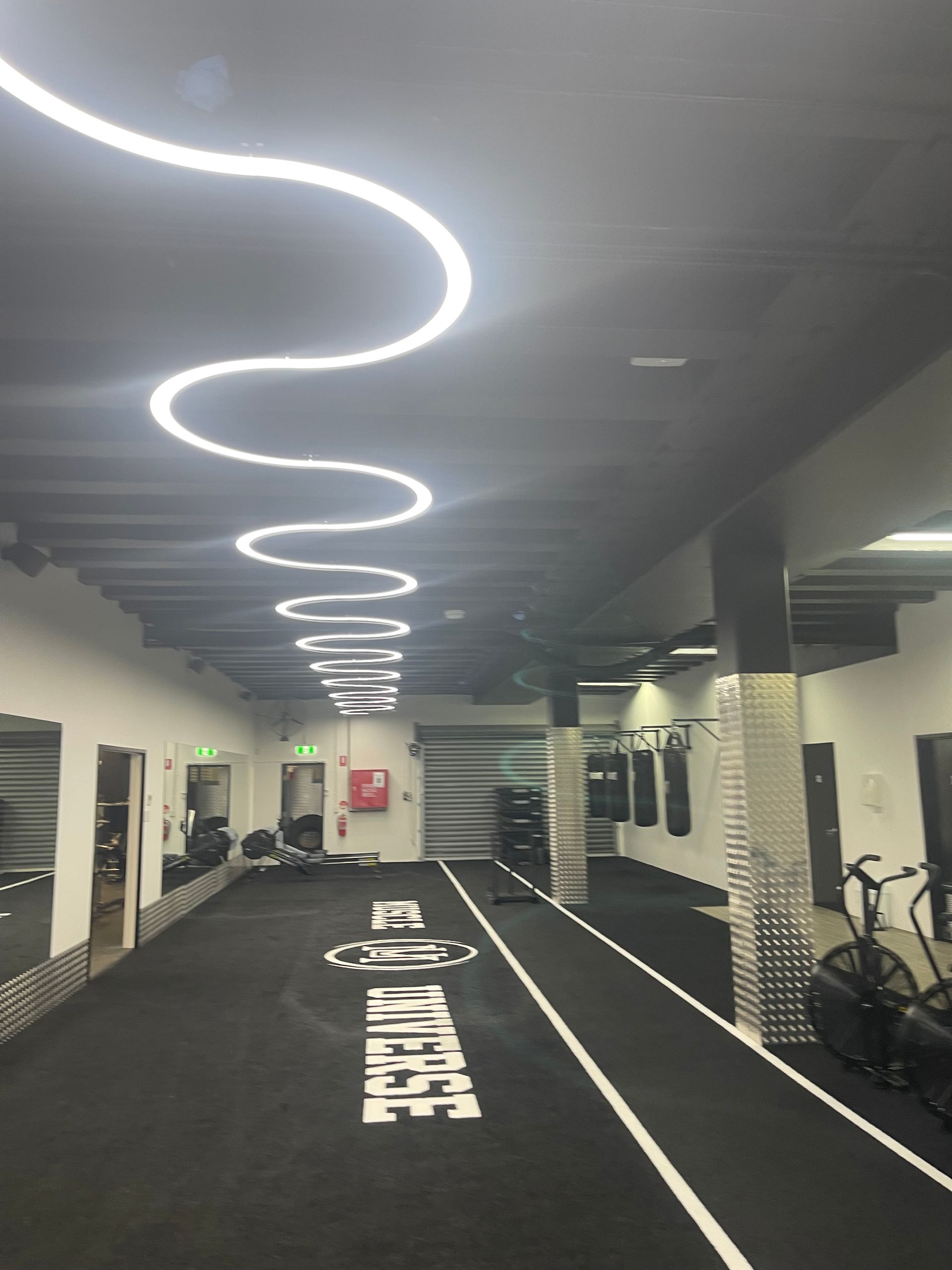 A gym with a track that says ' infinite ' on it