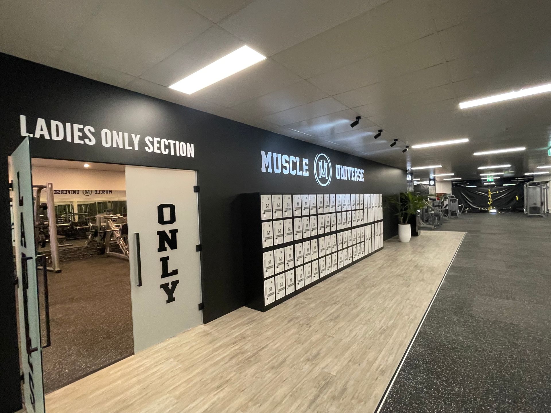 A gym with a ladies only section and a locker room.