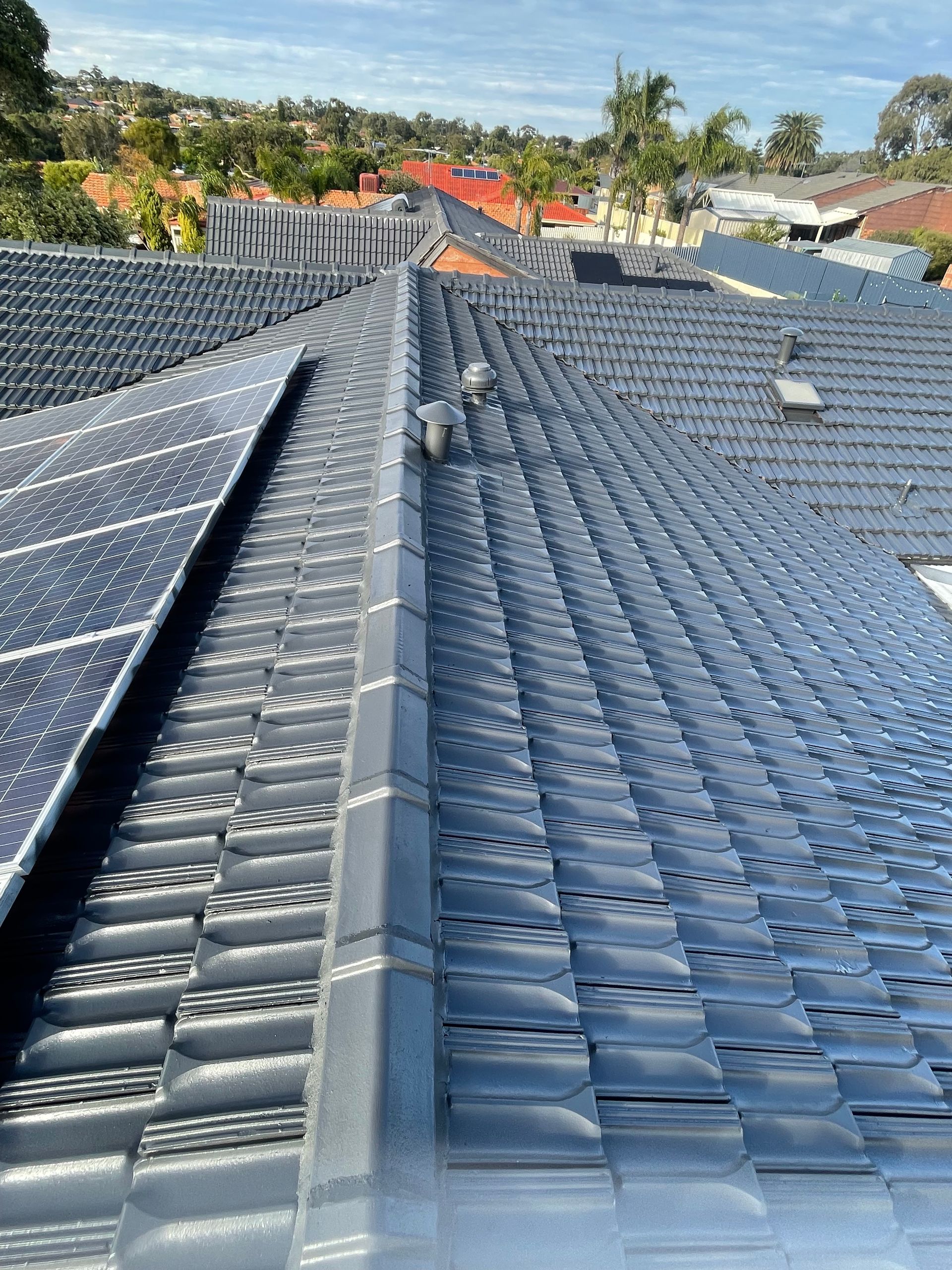 A roof with a lot of solar panels on it