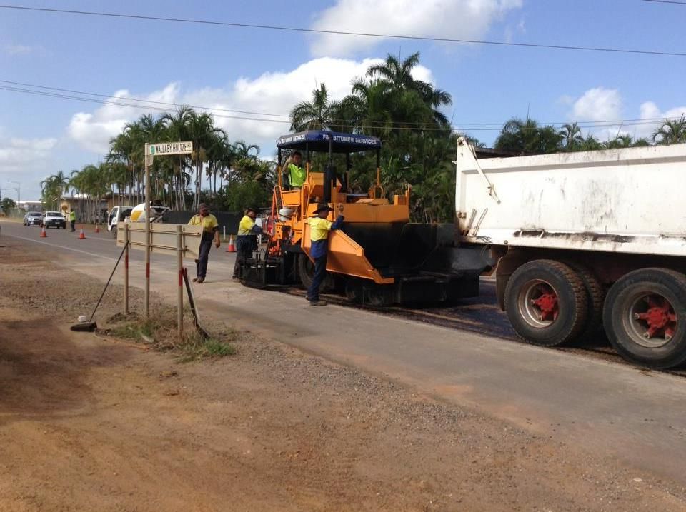 A Yellow Bulldozer With A White Truck — JLM Contracting Services Pty Ltd in Virginia, NT