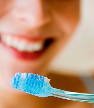 Woman Flossing Her Teeth — Dental Services in Deerfield Beach, FL