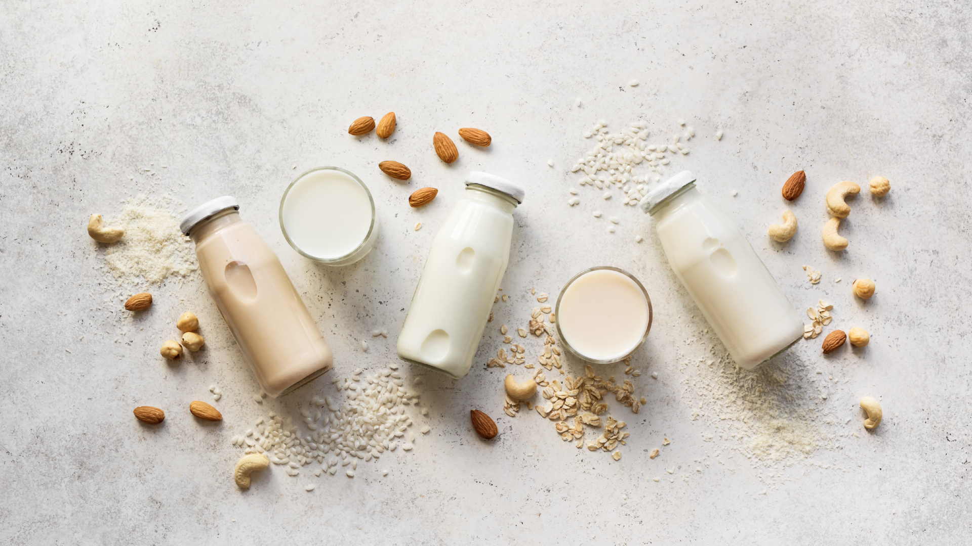 There are many different types of milk on the table.