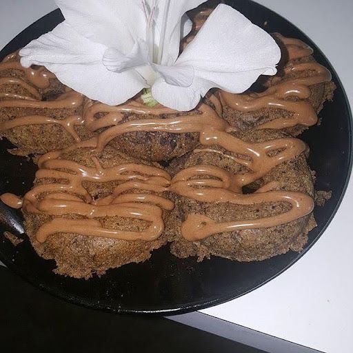 A close up of a plate of food with a flower on top.