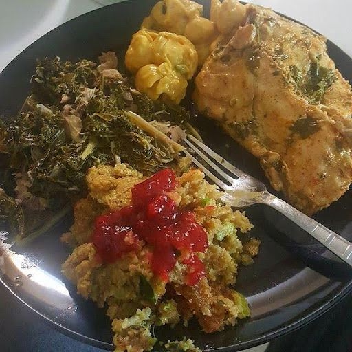 There is a plate of food with a fork on it.