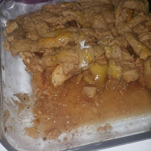 A close up of a casserole dish filled with food on a table.