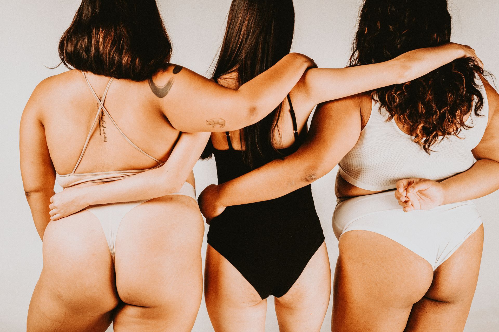 Women with different body types standing together