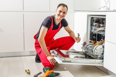Man Working On A Dishwasher – Orlando, FL – Willard Appliance Inc.